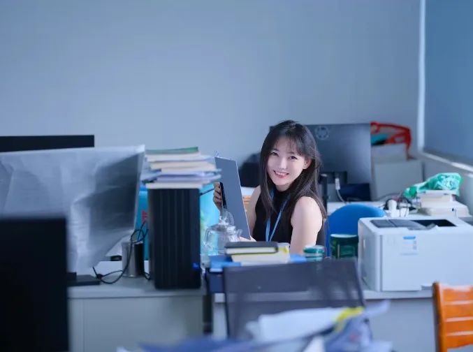 Alice Wu at her desk in the company office in Shenzhen